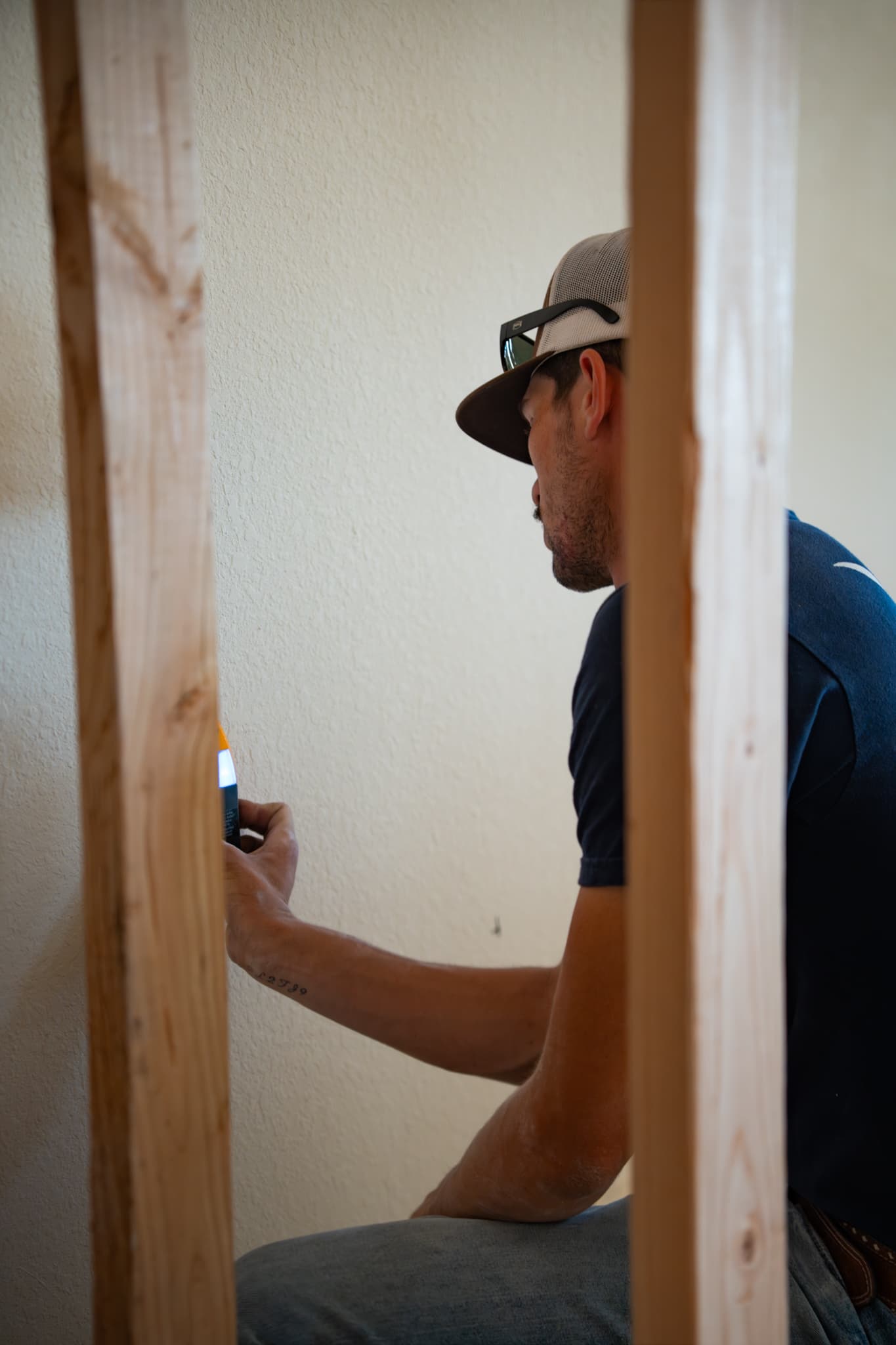 Southern Circuit Co. electrician checking a wall before drywall on a new build